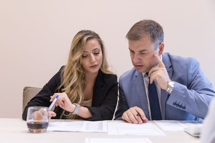 A lawyer evaluating a theft case with a client